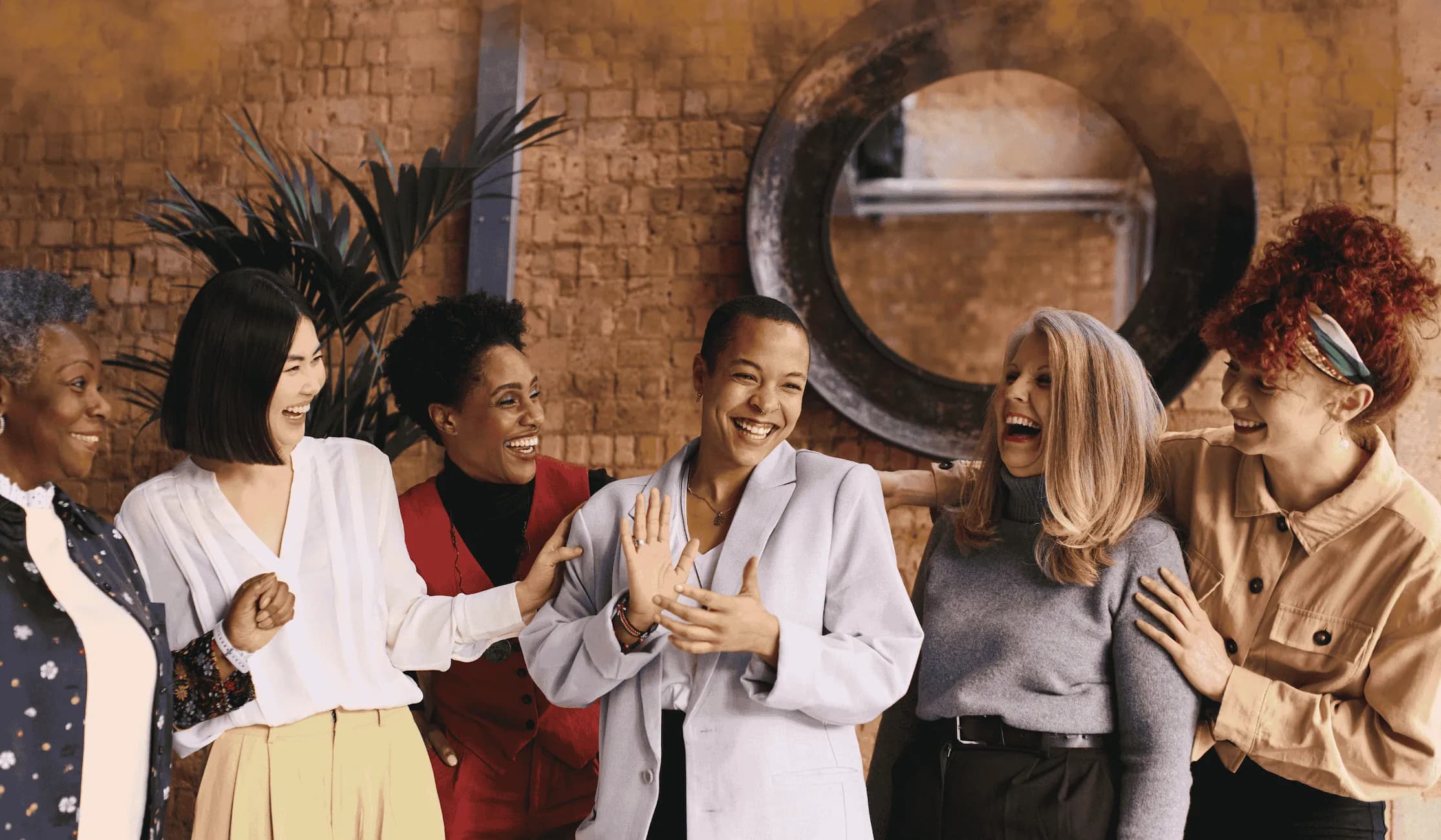 Diverse group of women laughing together
